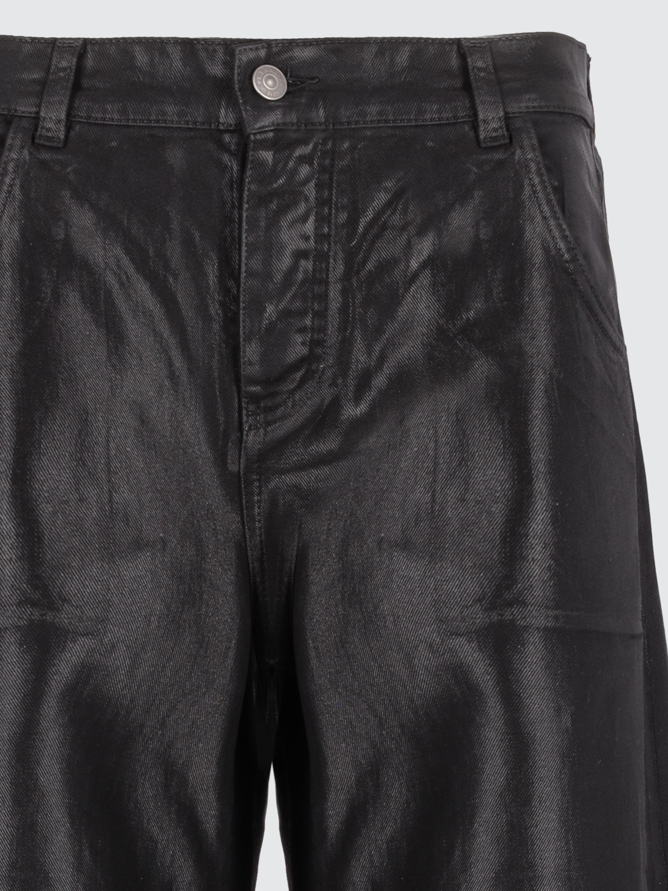 Jeans baggy spalmati effetto pelle