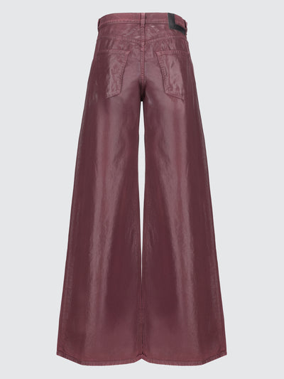 Jeans baggy spalmati effetto pelle